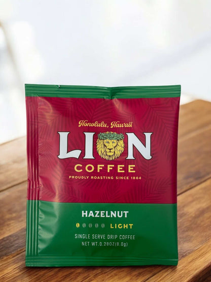 LION COFFEE Hazelnut Flavored Drip Bag on Wooden Surface