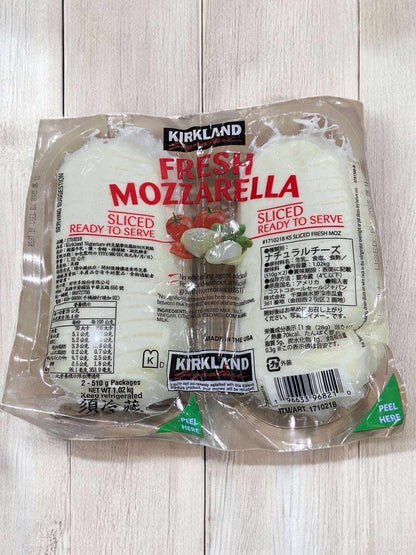 Sliced fresh mozzarella cheese by Kirkland Signature, ideal for salads and pizzas, 510g x 2 packs.