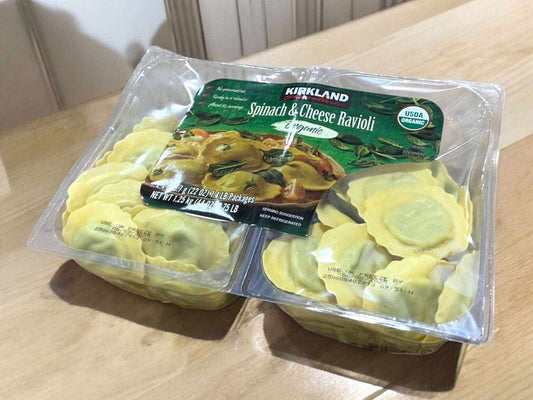 Organic spinach and cheese ravioli packaging by Kirkland Signature, perfect for convenient and nutritious meals.