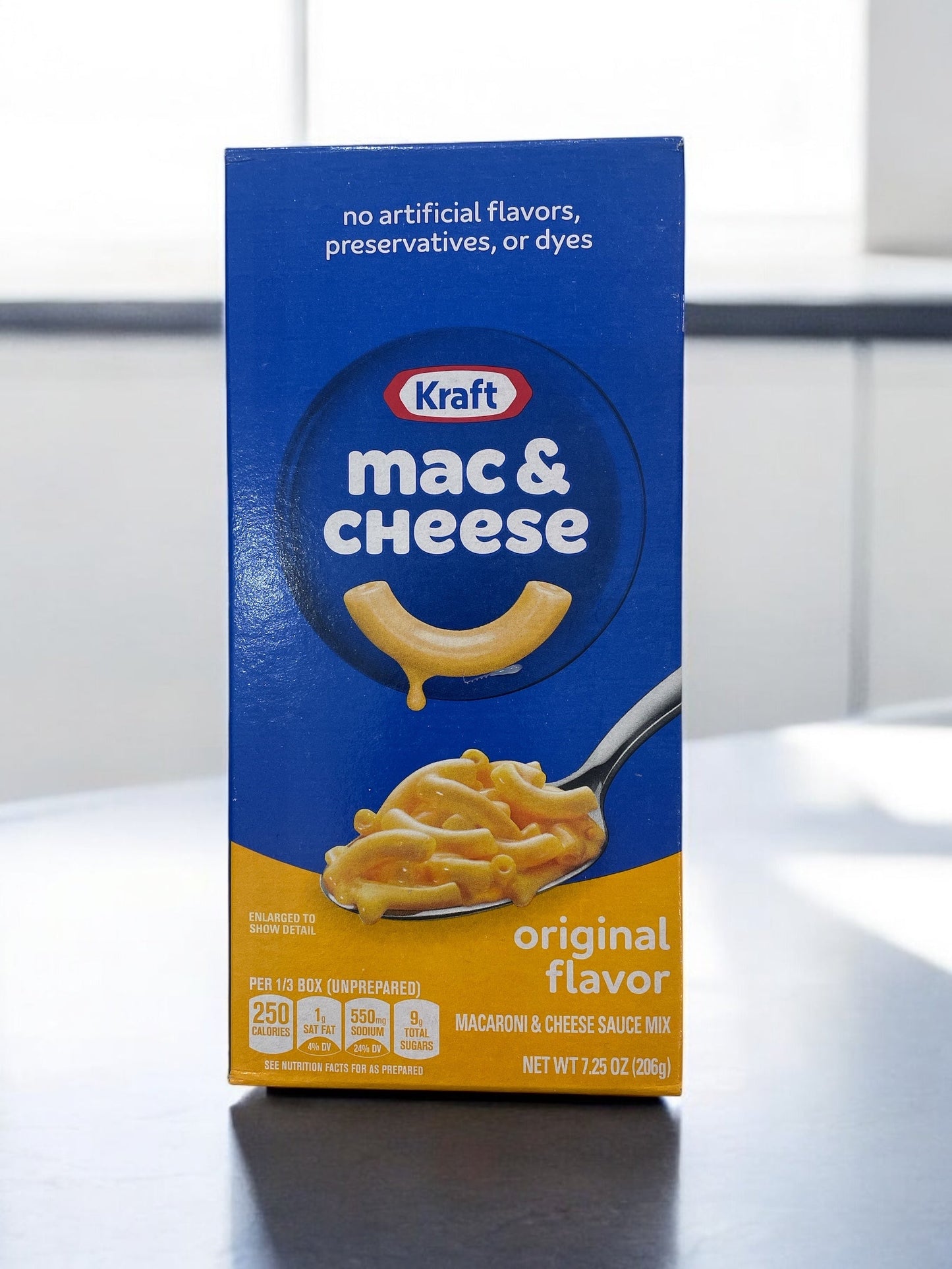 Kraft mac and cheese box with creamy cheese sauce, 205.5g package.