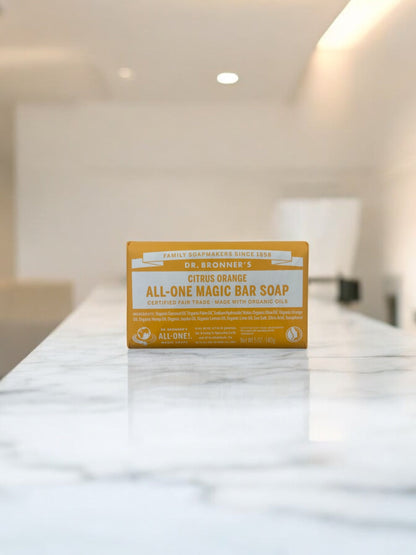 Dr. Bronner's Organic Magic Bar Soap Citrus Orange 140g on marble surface.