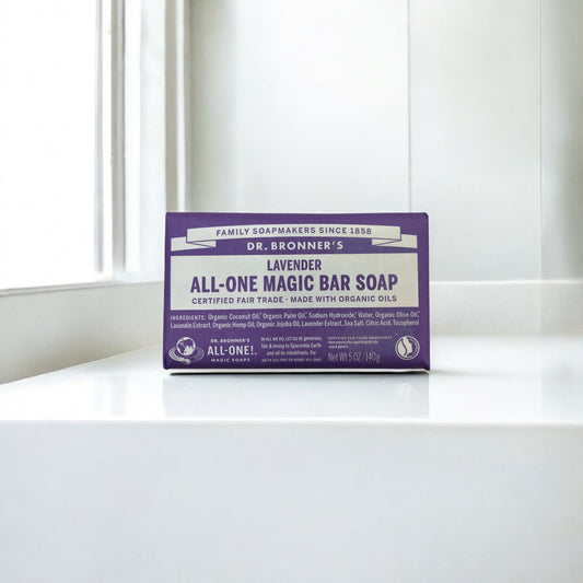 Dr. Bronner's organic lavender soap bar, 140g, on a white surface.