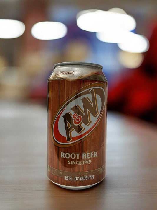 A&W Root Beer can, 355ml, caffeine-free non-alcoholic beverage with vanilla and herbal flavors.