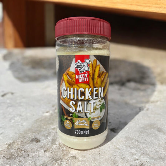 NICE N TASTY Chicken Salt 700g seasoning bottle on a stone surface, herb and spice blend.