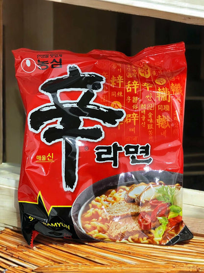Nongshim Shin Ramyun spicy Korean instant noodles with rich red packaging and bowl of spicy soup illustration