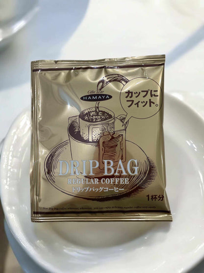 Hamaya drip bag coffee single serving regular coffee packet on white plate